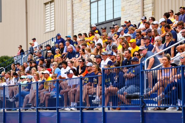 A photo of fans sitting in the stands at Paul Hotmer Soccer Field watching a Toledo Women's Soccer game.